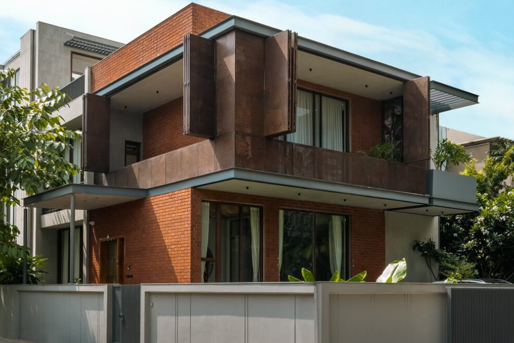 Brick vault weekend villa with earthy raw architecture and landscape design.