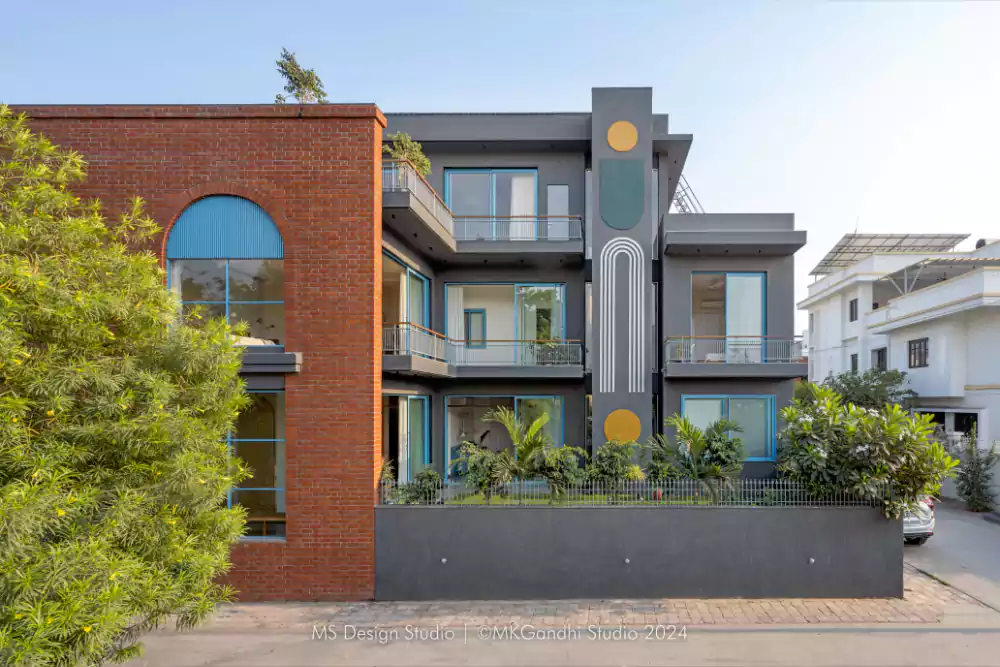 Multi-color Kota stone flooring, arched window, brick and

stone-crete façade with a serene vibe.